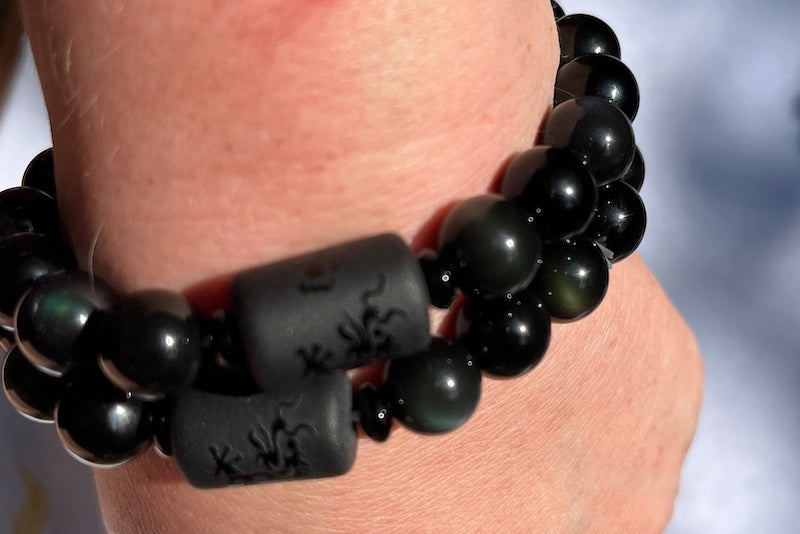 Bracelet, Rainbow Obsidian and 10 mm beads with long cylinder bead of phoenix or dragon