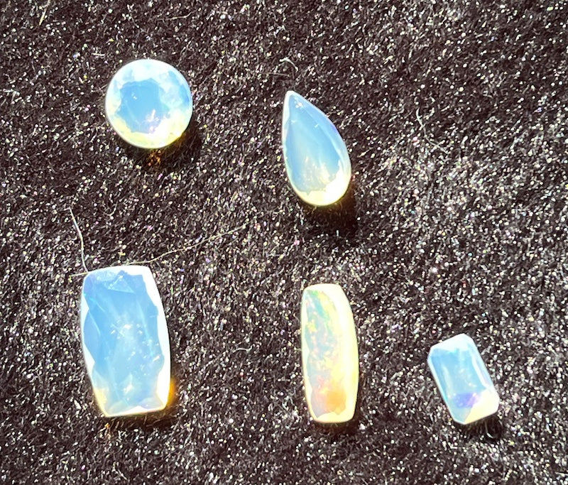 Opals, cushion rectangle shape, pink, blue and yellow flash.