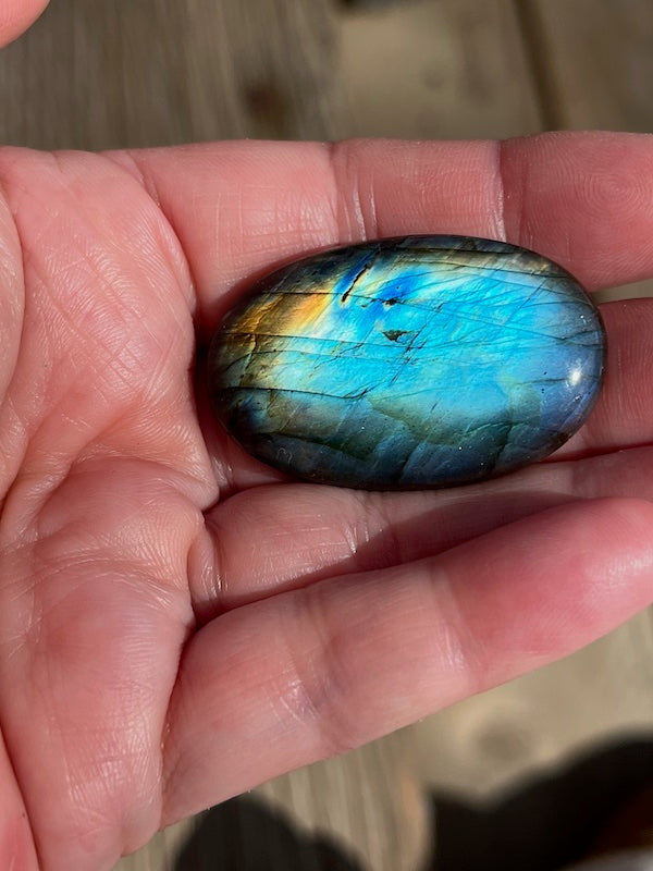 Labradorite Oval Cabochons with varing Blue, orange, yellow and purple flash.