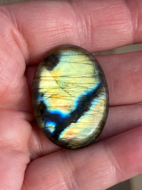 Labradorite Oval Cabochons with varing Blue, orange, yellow and purple flash.