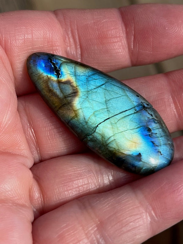 Labradorite Oval Cabochons with varing Blue, orange, yellow and purple flash.