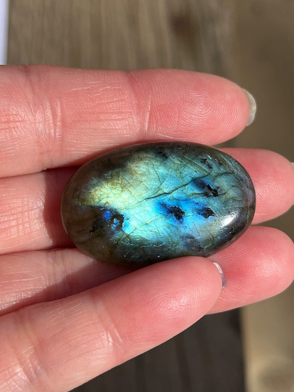 Labradorite Oval Cabochons with varing Blue, orange, yellow and purple flash.