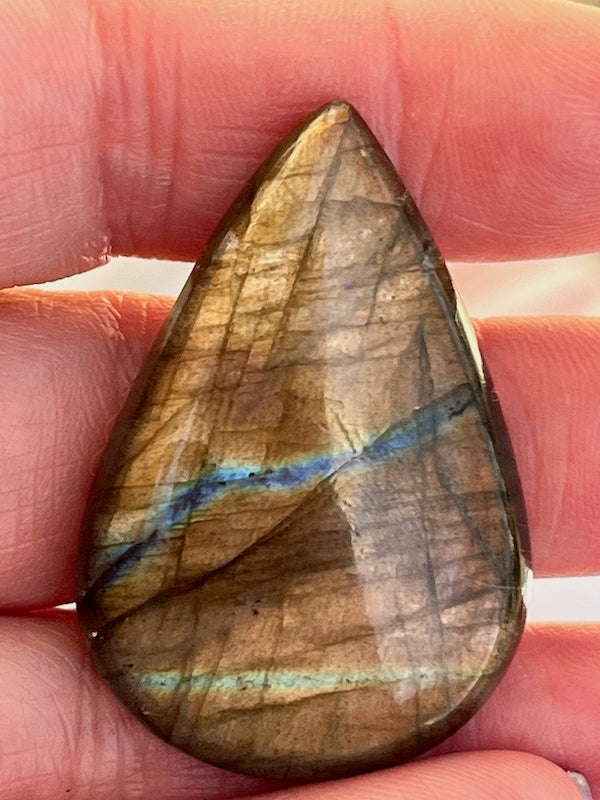 Labradorite Teardrop, Pear Cabochons with varing Blue, orange, yellow and purple flash.