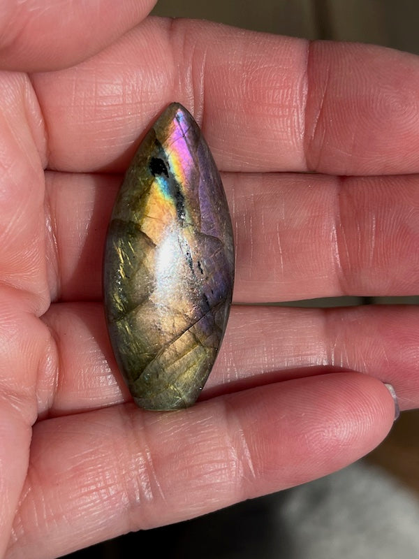 Labradorite Teardrop, Pear Cabochons with varing Blue, orange, yellow and purple flash.