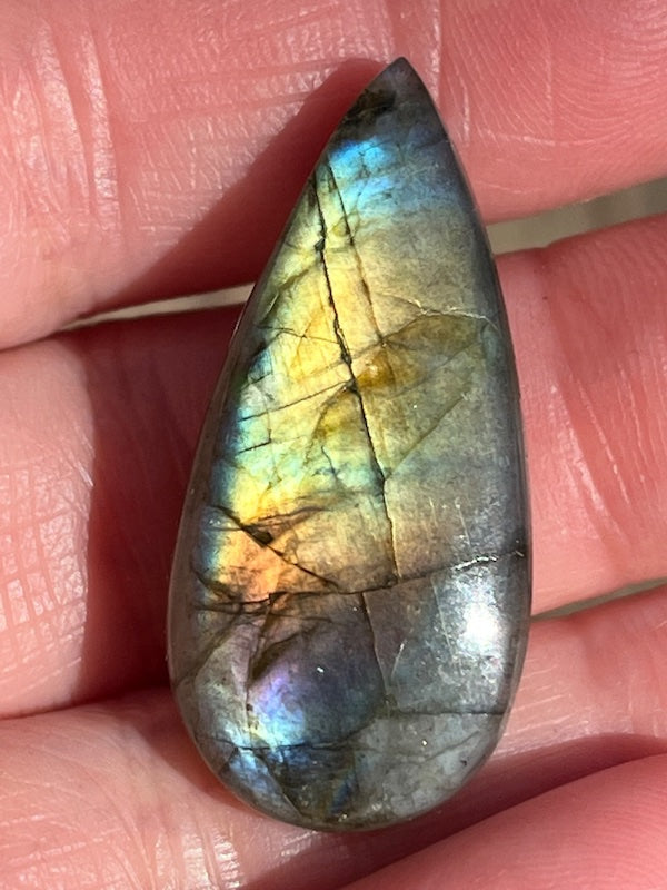 Labradorite Teardrop, Pear Cabochons with varing Blue, orange, yellow and purple flash.