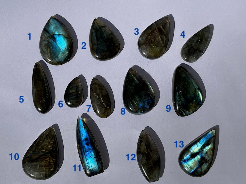 Labradorite Teardrop, Pear Cabochons with varing Blue, orange, yellow and purple flash.