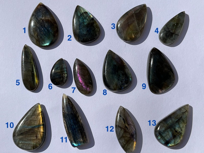 Labradorite Teardrop, Pear Cabochons with varing Blue, orange, yellow and purple flash.