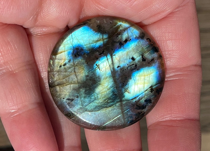 Labradorite Round Cabochons with vering Blue, orange, yellow and purple flash.