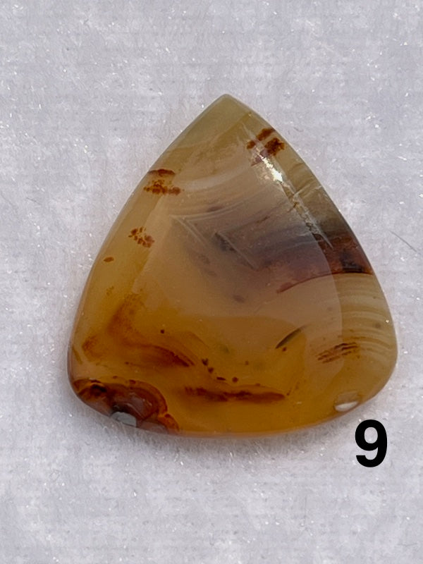 Multi coloured brown lace agate cabochons.