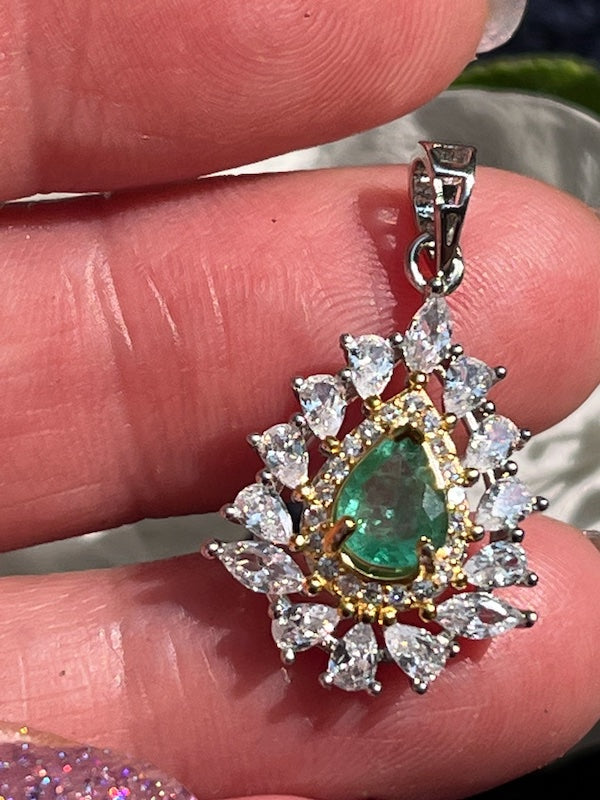 Pendant, Natural Sparkling Emerald with cz accent set in sterling silver.