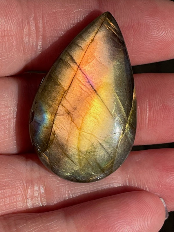 Labradorite Teardrop, Pear Cabochons with varing Blue, orange, yellow and purple flash.