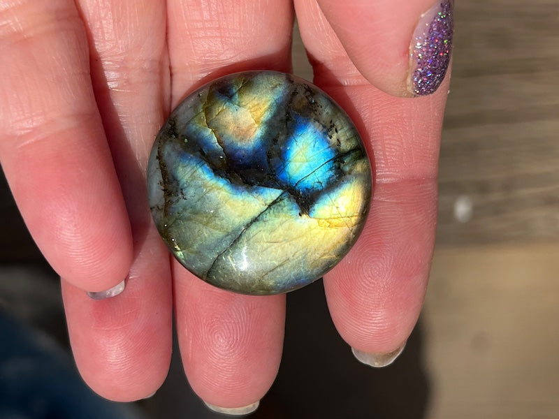 Labradorite Round Cabochons with vering Blue, orange, yellow and purple flash.