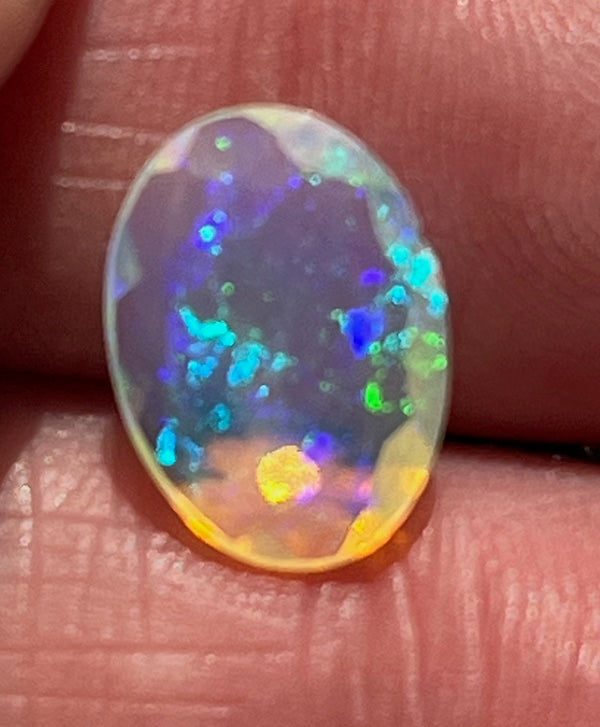 Faceted Opals, oval, pink, blue and yellow flash.