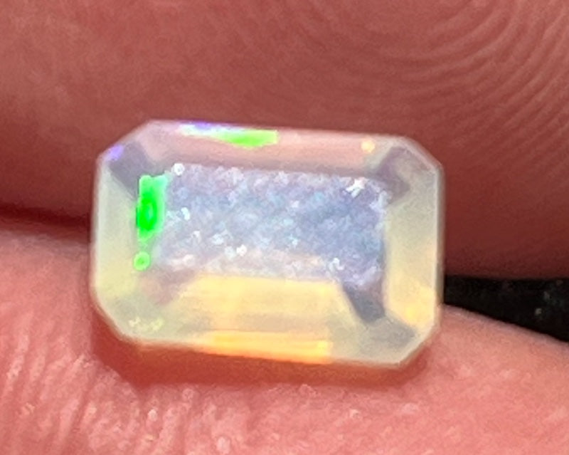 Opals, cushion rectangle shape, pink, blue and yellow flash.