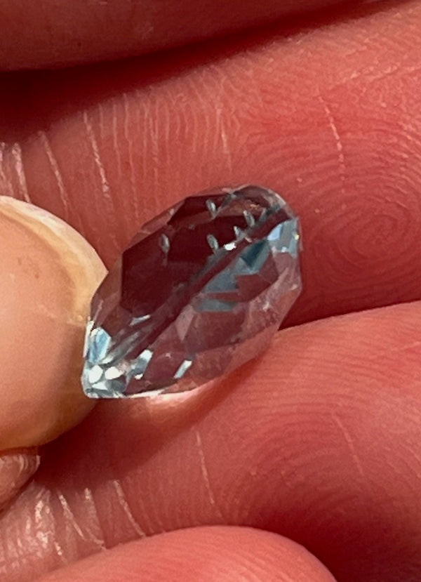 Topaz A+++ Faceted Heart cushion cut, rounded on both sides.